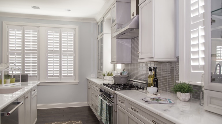 White shutters in Virginia Beach kitchen with white cabinets.